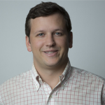 A headshot of Brian Mikinski